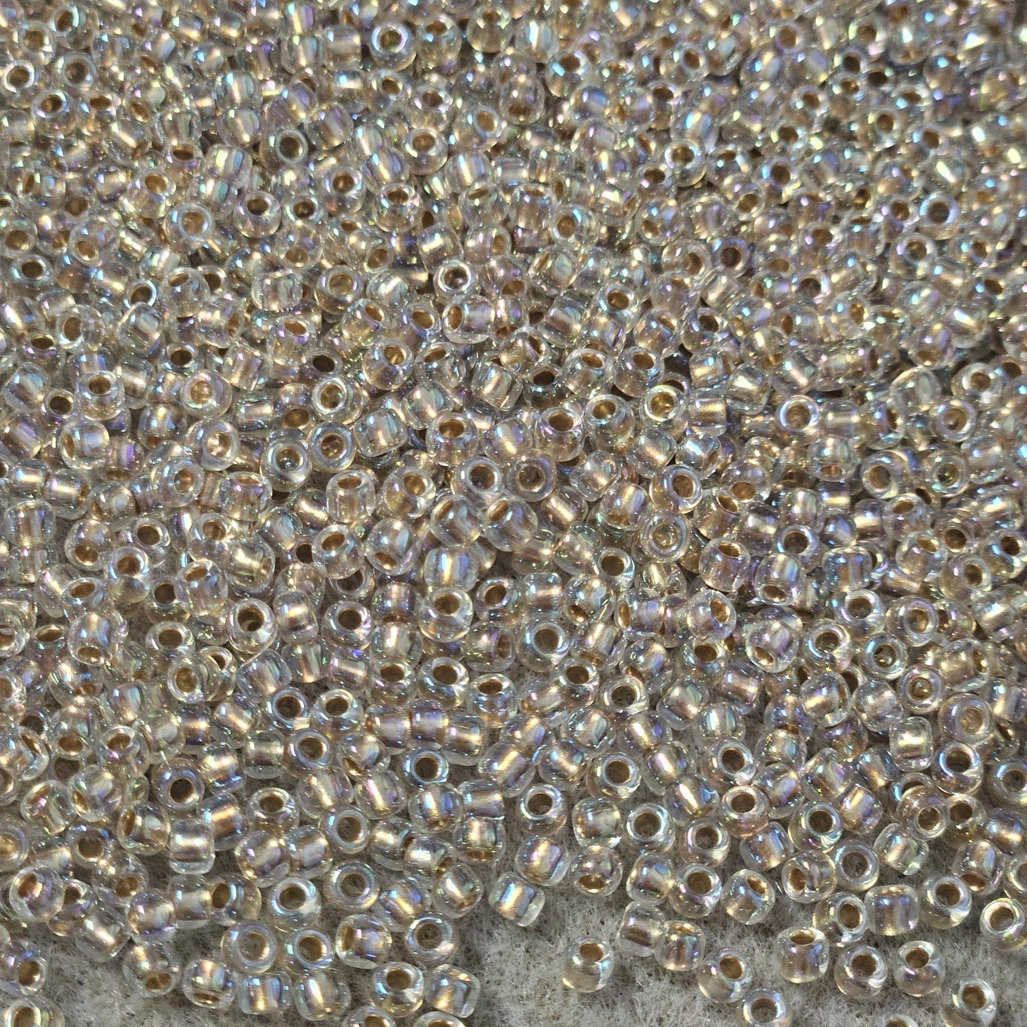 Toho 8/0 0994 Gold Lined Rainbow Crystal — Imaginea 1