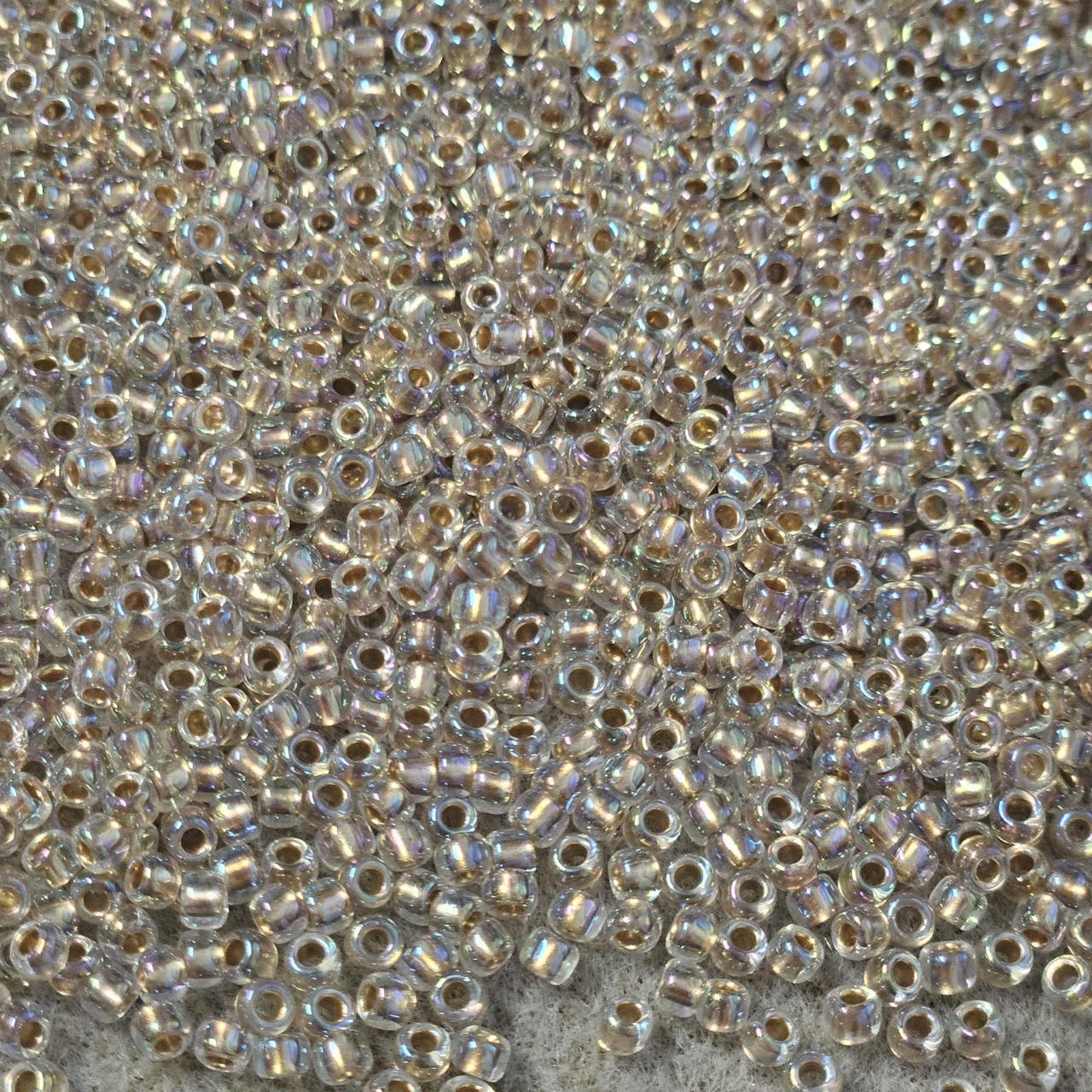 Toho 8/0 0994 Gold Lined Rainbow Crystal